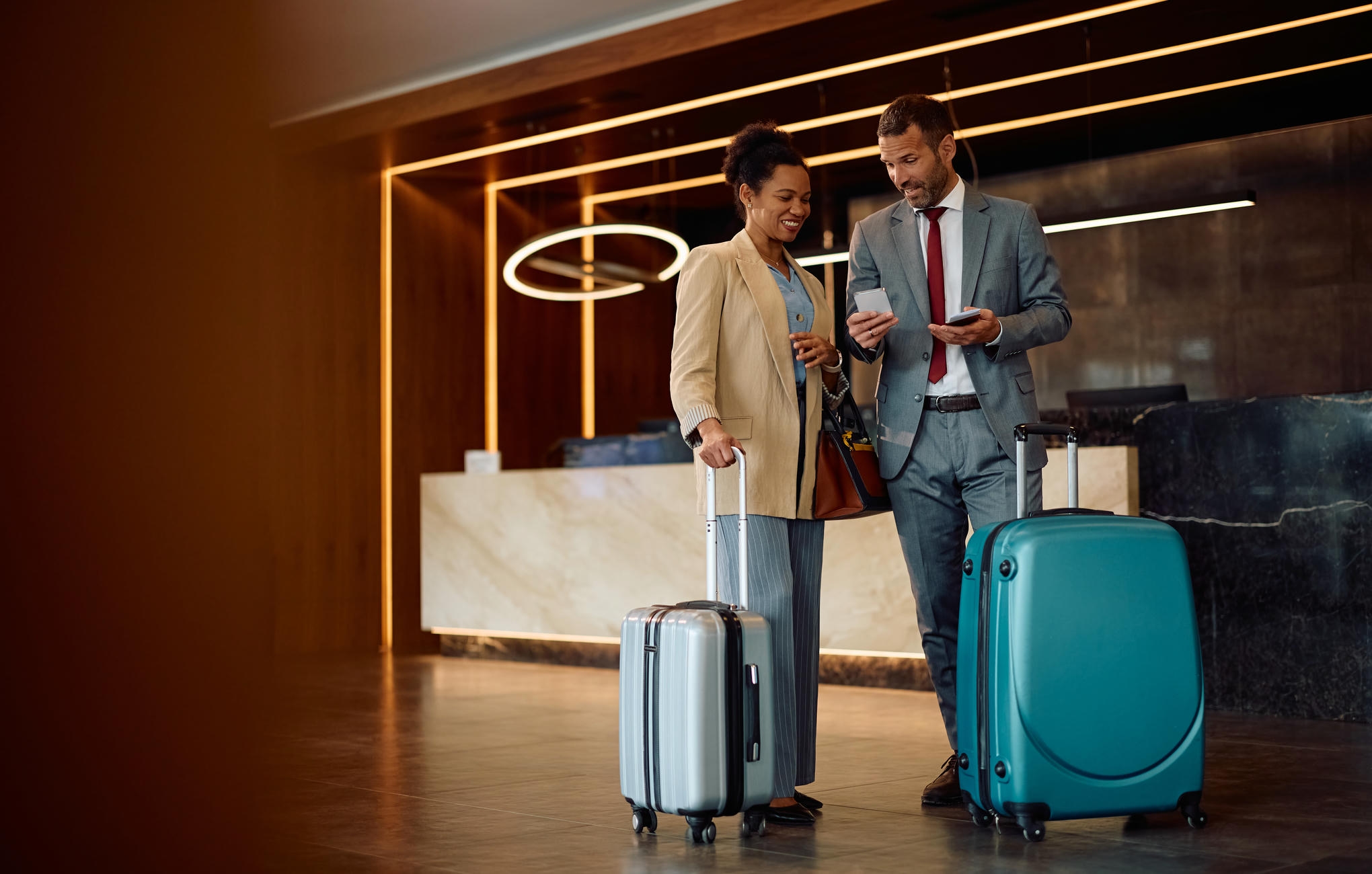 Business travellers arriving at a hotel for GISEC 2026 in Dubai